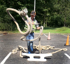 student tossing a rope