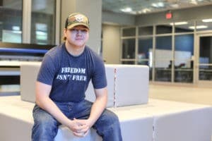 Andrew Hearn, seated