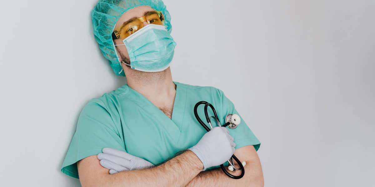 young male doctor in mask