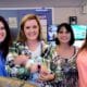 Paramedic Anna Cain, dispatcher Paige Cook with baby Nola, grandmother Dana Hearn and mother Hannah Hearn