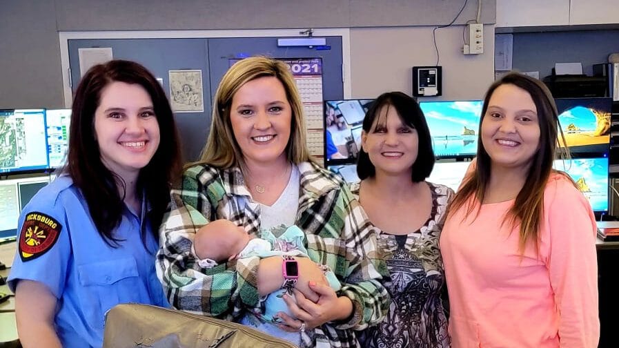 Paramedic Anna Cain, dispatcher Paige Cook with baby Nola, grandmother Dana Hearn and mother Hannah Hearn