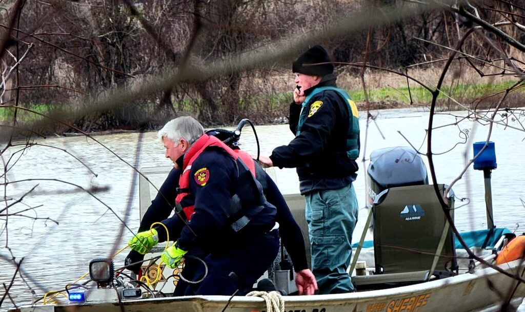 The fire department's Tim Love and Sheriff Pace on the water. Photo by David Day