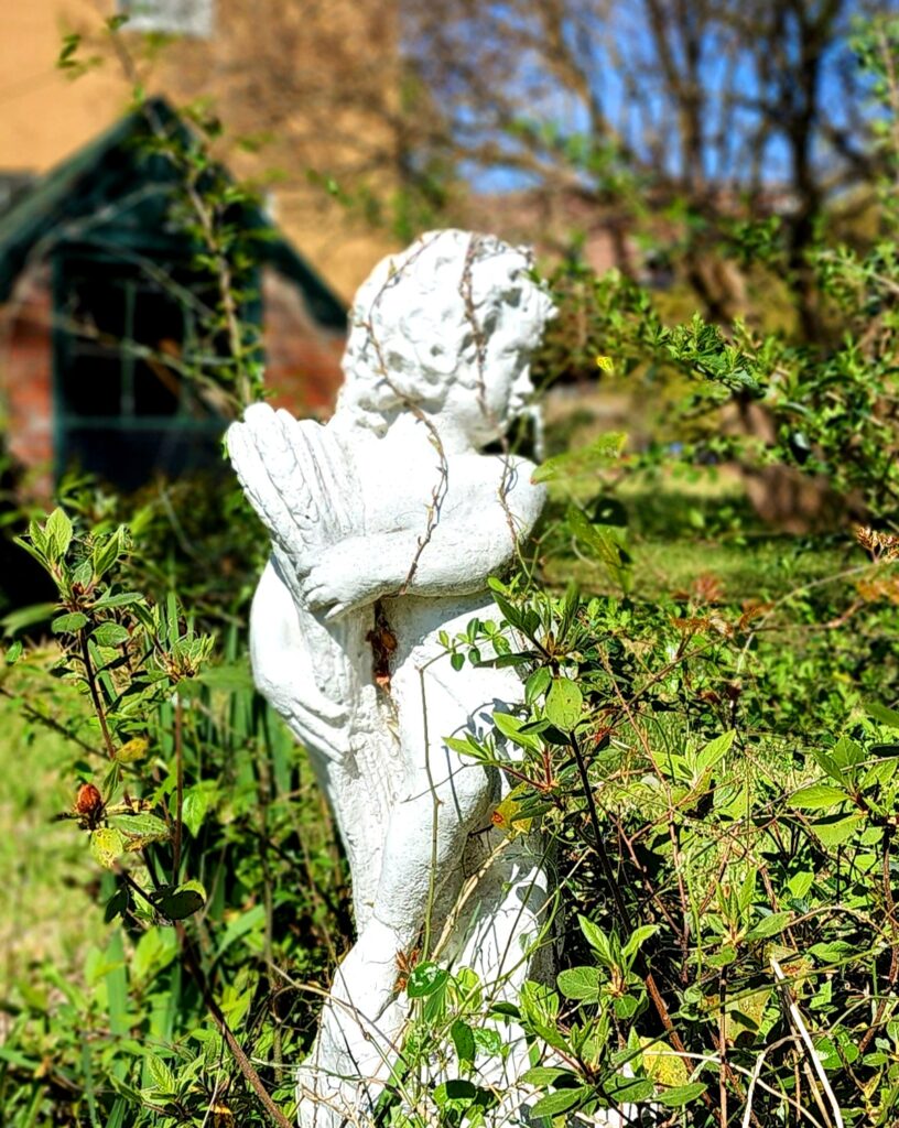 A statuette in the gardens. Photo by David Day