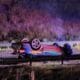 A green Mustang with multi-colored stripes is overturned on Clay at I-20. Photo by David Day