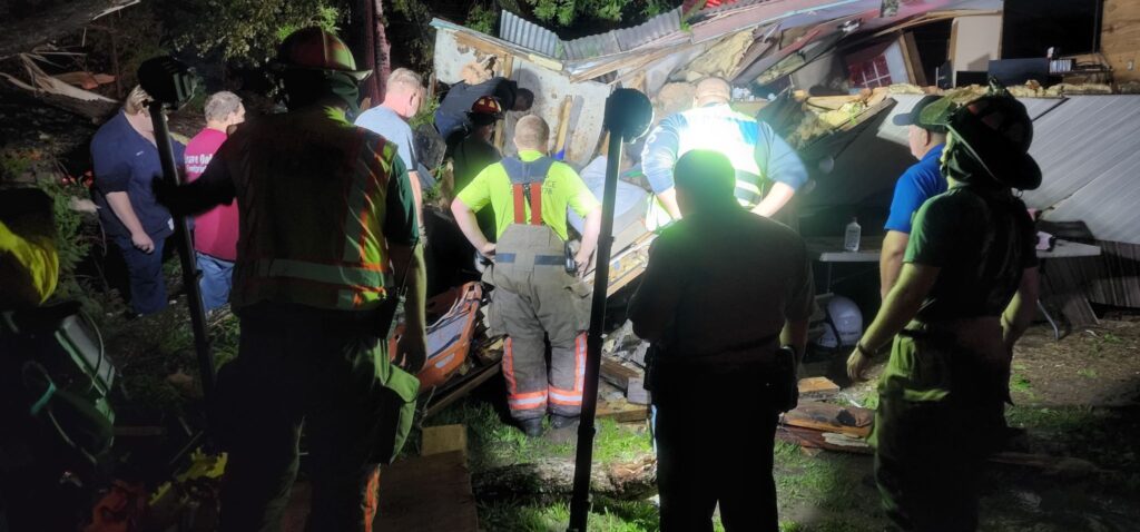 woman trapped by fallen tree
