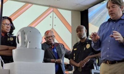 Chief Jones, Mayor Flaggs, Lt. Smith and Bryan Lagarde look at one of the high end cameras. Photo by David Day