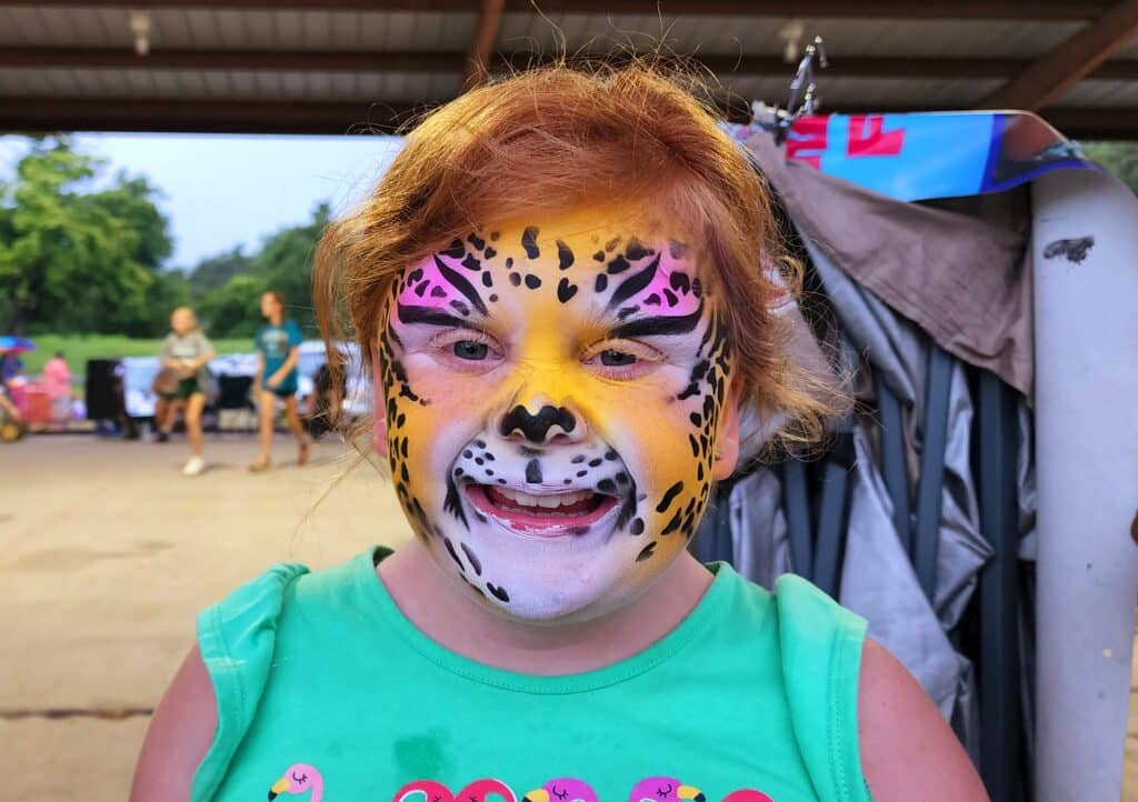 This 9 year old was pleased with the face paint. Photo by David Day