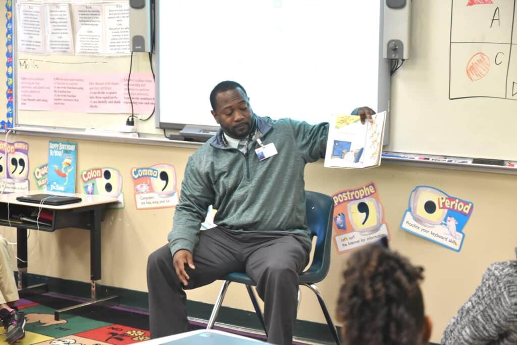 Preston Nailor reading to kids