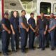 Firefighters with their new truck. Photo by David Day