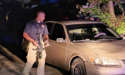 Adam-4, Troy Kimble inspects the crime scene. Photo by David Day