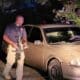 Adam-4, Troy Kimble inspects the crime scene. Photo by David Day