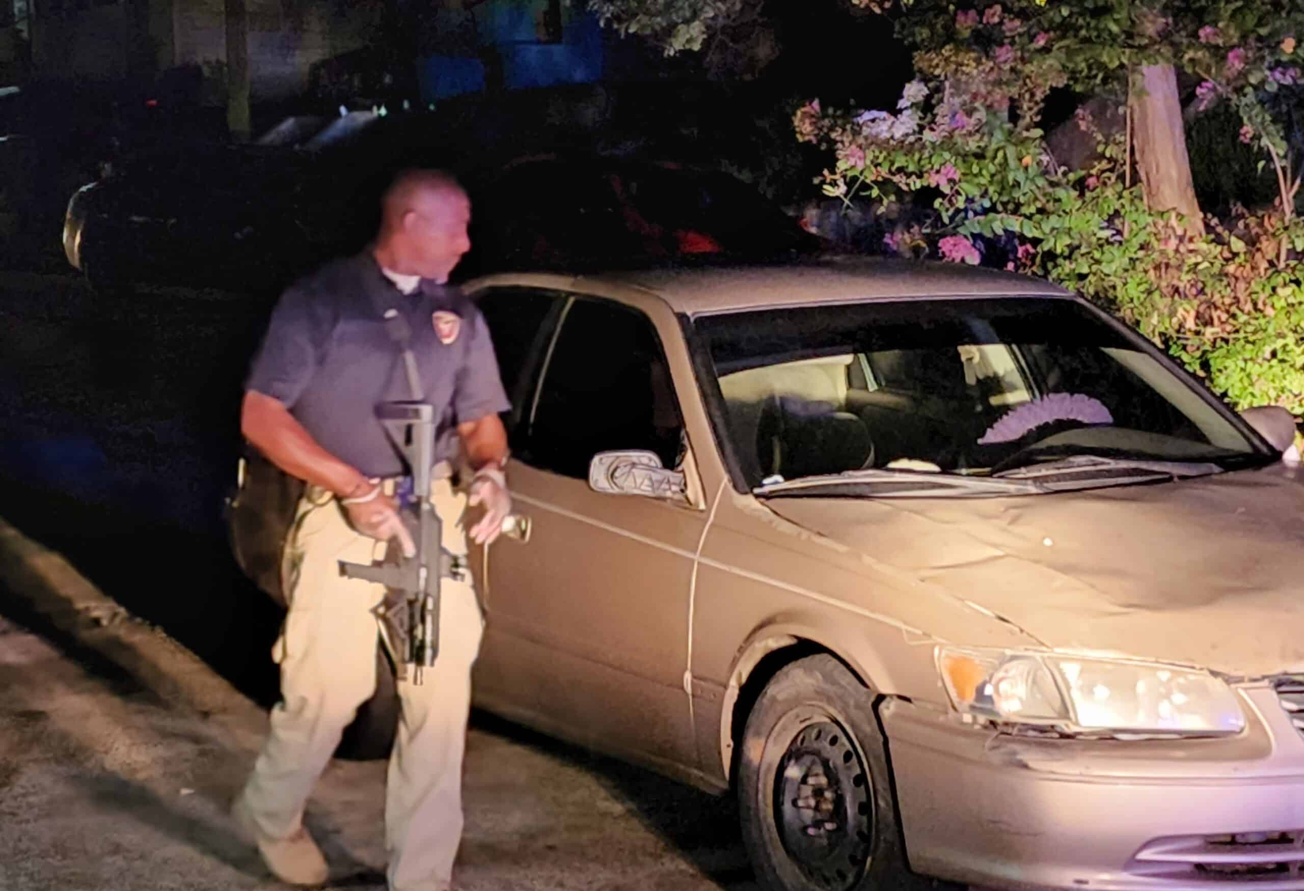 Adam-4, Troy Kimble inspects the crime scene. Photo by David Day