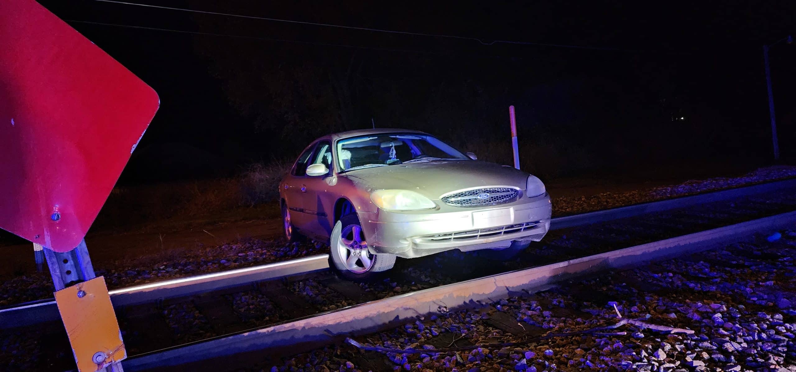 car stuck on railroad tracks