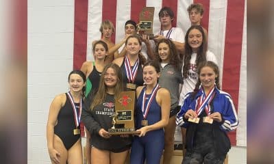 WC swim team holding trophy