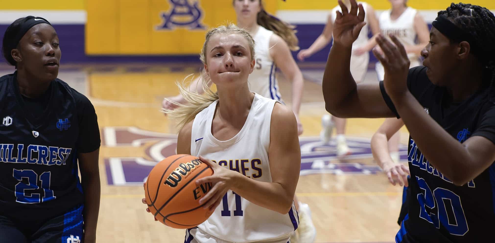 Olivia Larsen playing basketball
