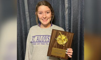 Kyleigh Cooper holding plaque
