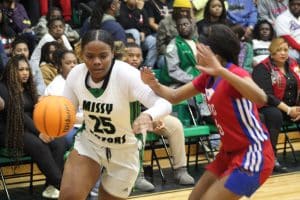 Cynia Johnson driving the ball