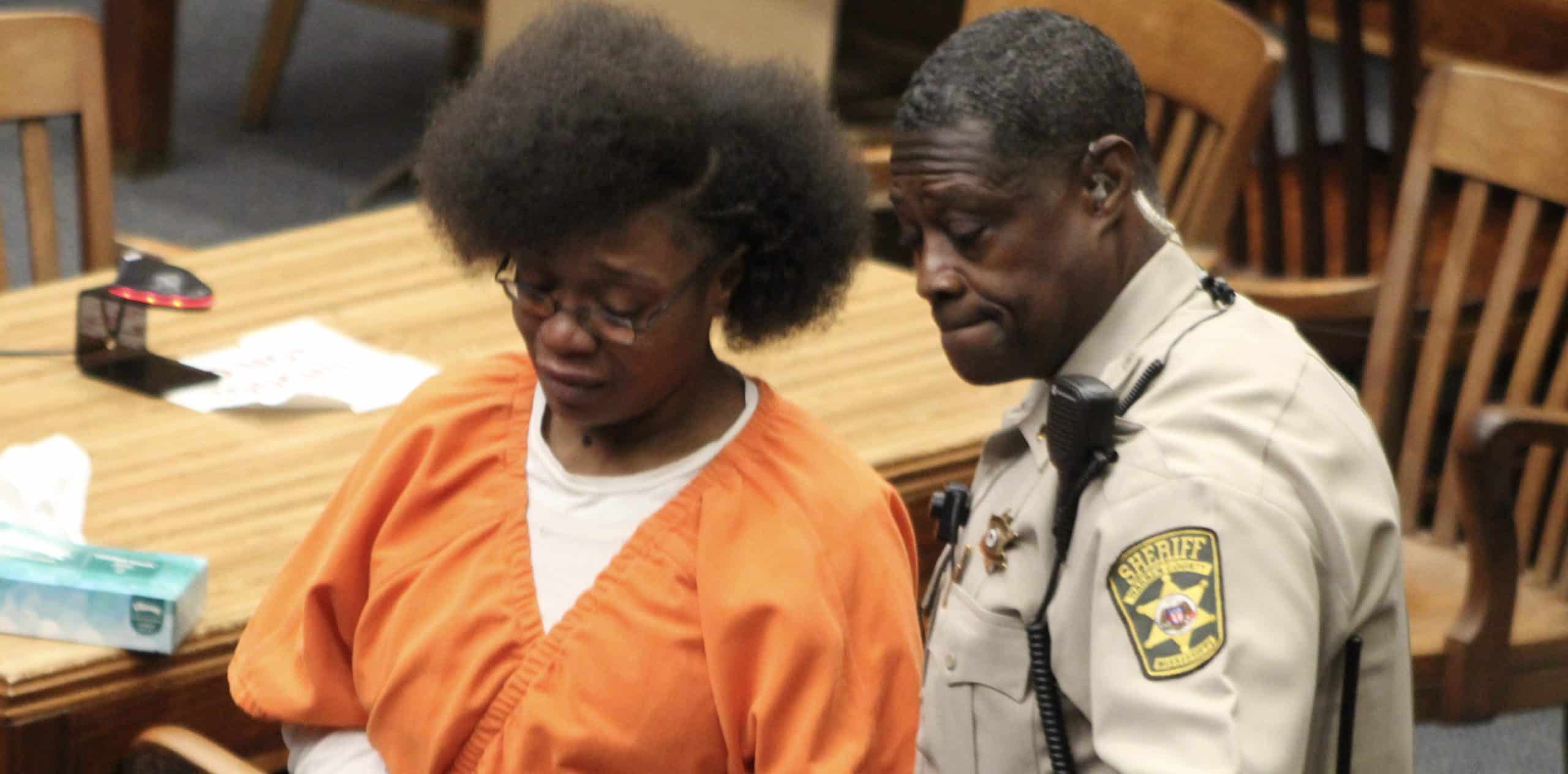Jennifer Linear being escorted out of court