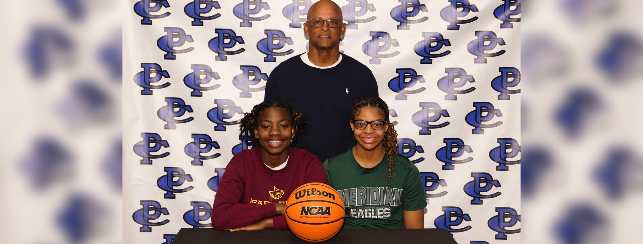 Coach Casey Fisher and Jae’la Smith and Lauren Madison