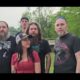 Group of musicians and event organizers posing outdoors, promoting Muddy River Madness Vicksburg.